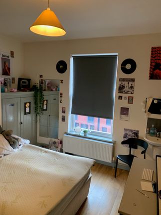 A Cozy Double Bedroom Featuring A Comfortable Bed ...