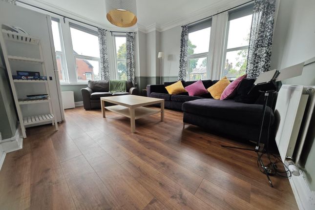 Bright And Spacious Living Room Featuring Large Ba...