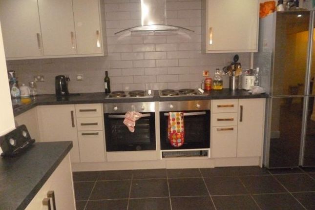 Modern And Tidy Kitchen With Ample Cabinetry, A La...