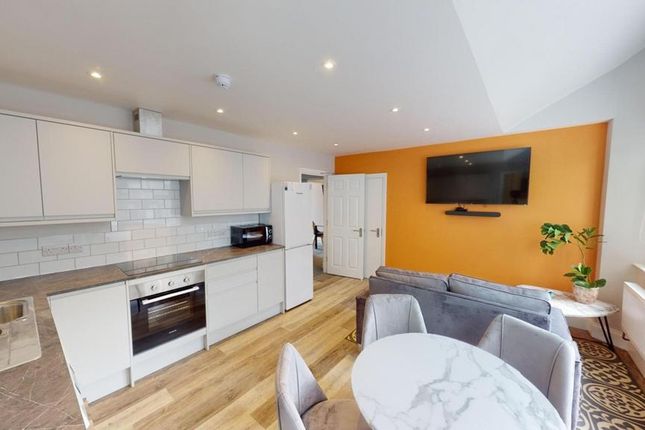 A Modern And Inviting Kitchenette With Bright Ligh...