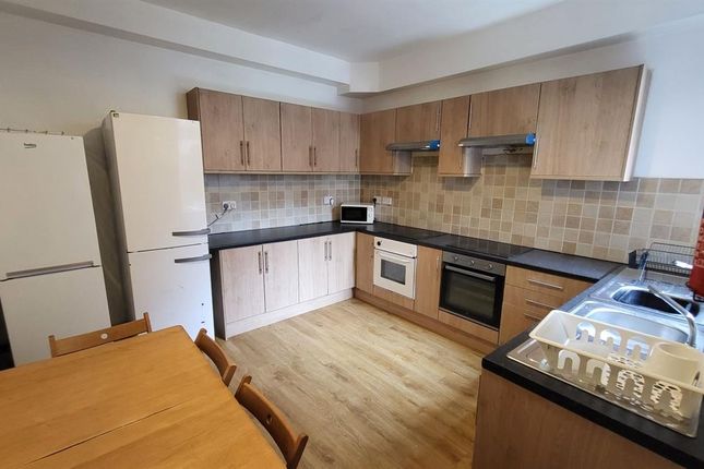 Bright And Spacious Kitchen Featuring Ample Wooden...