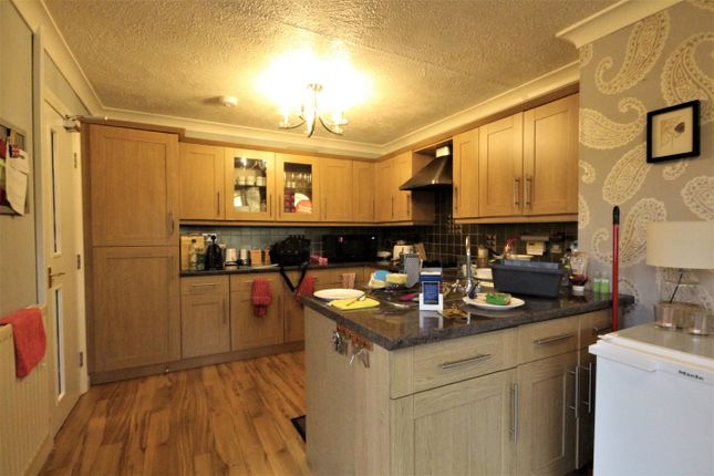 A Spacious And Inviting Kitchen With Ample Storage...