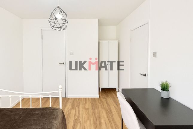 A Bright And Neat Student Bedroom Featuring White ...
