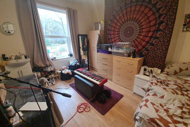 A Cozy And Personalized Single Bedroom Featuring A...