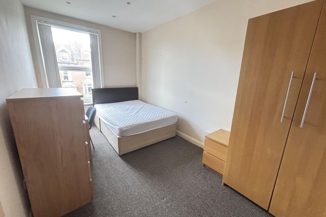 A Well-Maintained Bedroom Featuring A Comfortable ...