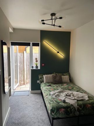 A Bright And Inviting Single Bedroom Featuring A m...