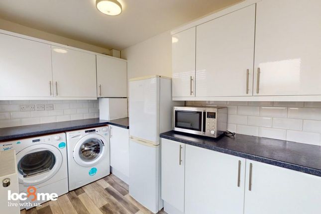 A Bright And Modern Kitchenette Featuring Ample St...