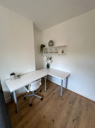 Bright And Inviting Communal Workspace Featuring T...