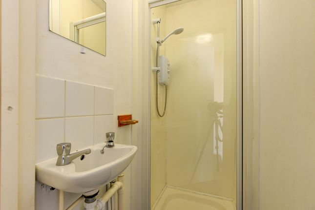 A Clean, Well-Maintained Bathroom With A Shower, S...