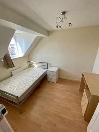 A Cozy Double Bedroom Featuring A Spacious Layout,...