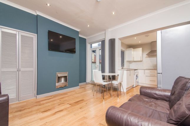 A Stylish Living Room Featuring A Cozy Seating Are...