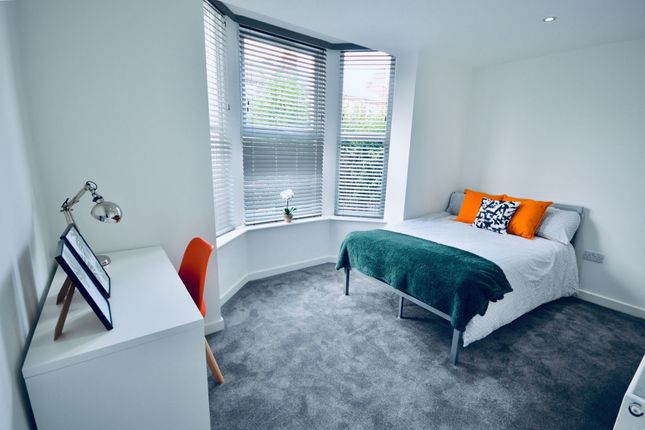 A Bright And Modern Bedroom Featuring A Large Bay ...