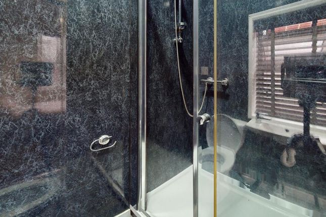 A Modern And Stylish Bathroom Featuring A Sleek Sh...