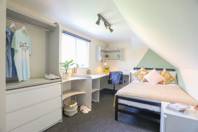 Bright And Well-Maintained Bedroom Featuring A Com...