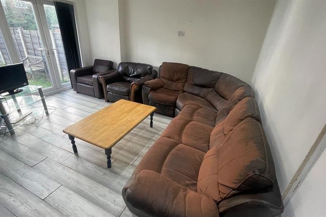 Spacious, Well-Lit Living Room With A Large Corner...