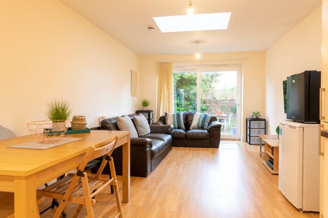 This Spacious Living Room Features A Comfortable S...