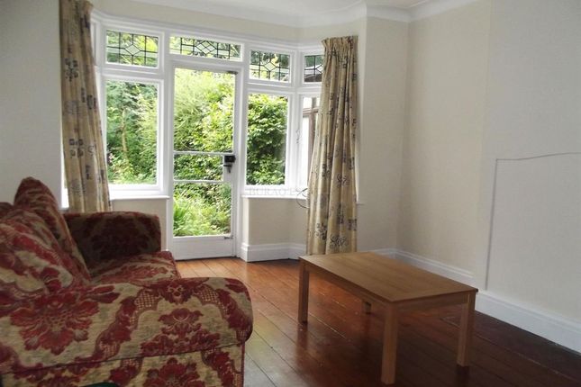 Bright Living Room With A Large Bay Window And Gar...