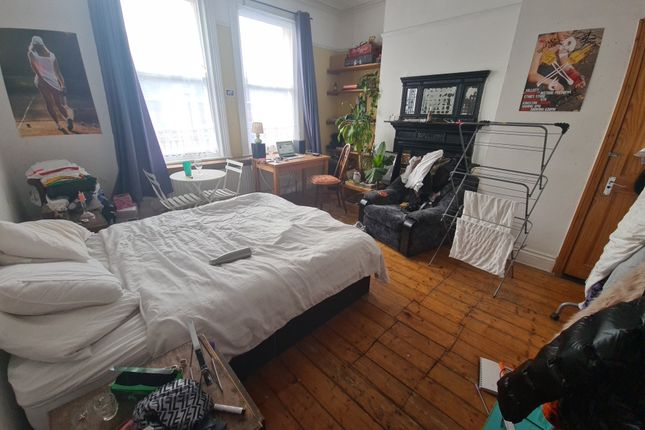 A Bright And Inviting Master Bedroom Featuring A l...