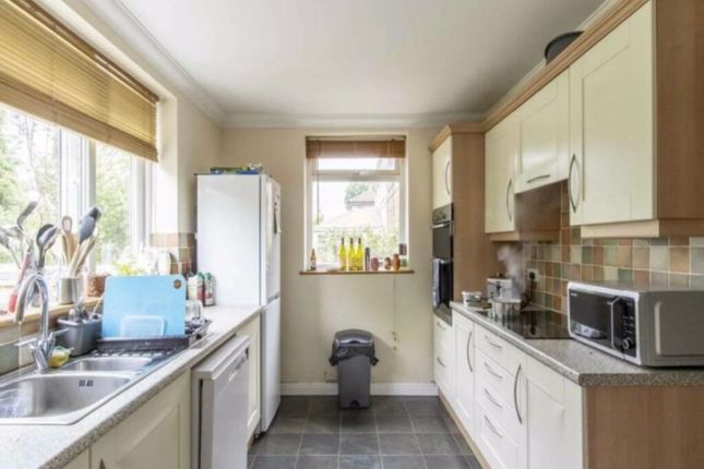 A Bright And Functional Kitchen Equipped With Mode...