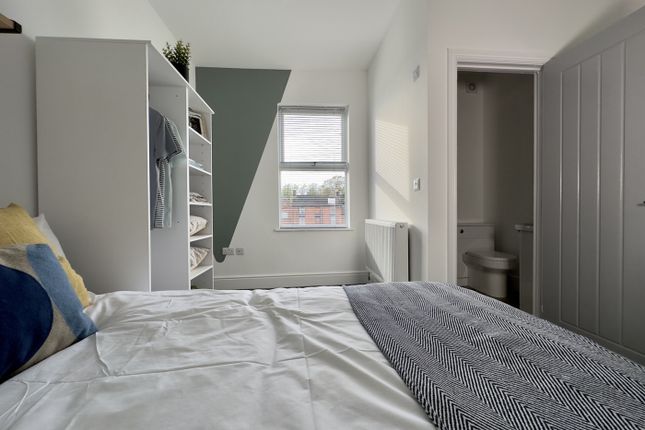 A Bright And Inviting Double Bedroom With Modern d...