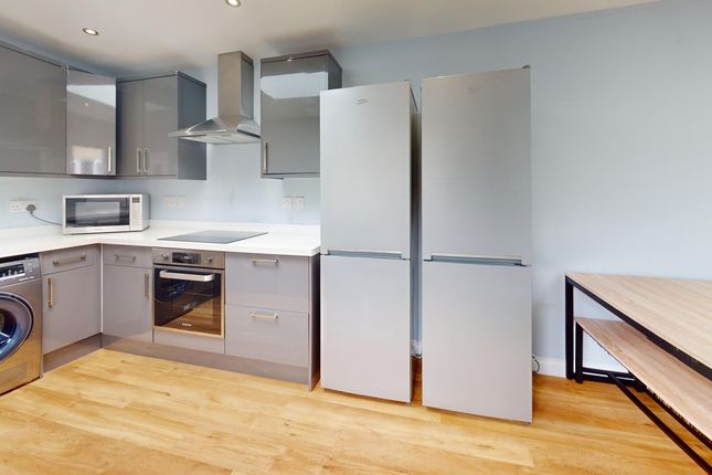 A Modern And Spacious Kitchenette Equipped With Sl...