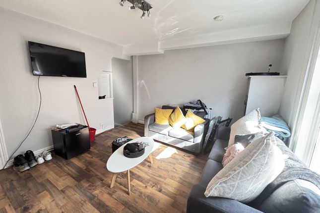 A Bright And Inviting Living Room Featuring Modern...