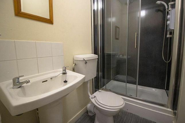 This Well-Maintained Bathroom Features A Modern Sh...