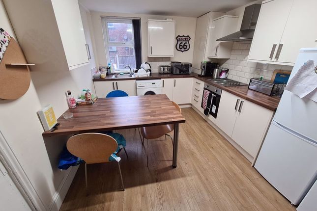 Bright And Modern Kitchen Featuring Ample Countert...