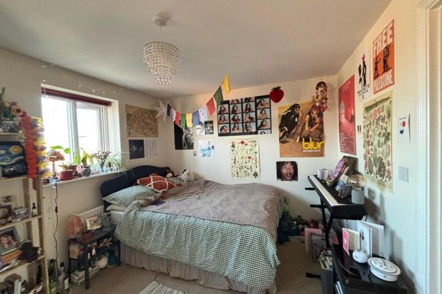 A Cozy Double Bedroom Featuring A Comfortable Bed,...