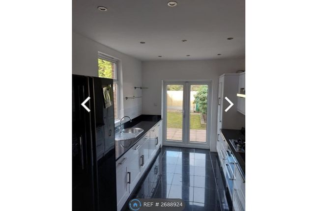 Kitchen With French Doors Onto Garden.
