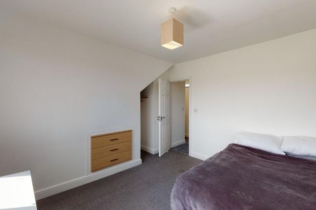 A Spacious And Clean Master Bedroom Featuring A Do...