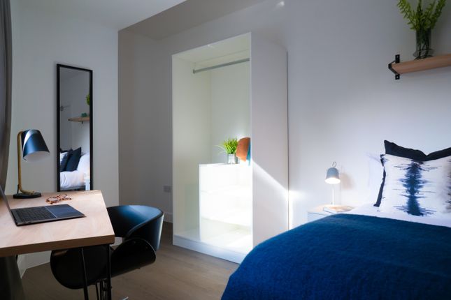 A Bright And Inviting Double Bedroom With Modern d...