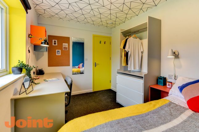 Bright And Colorful Student Bedroom Featuring A Co...