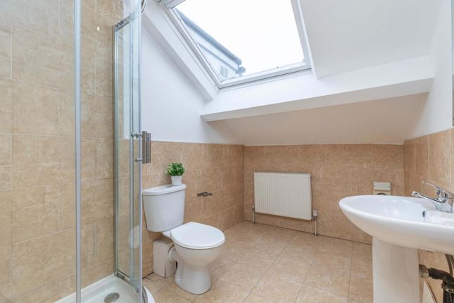 A Bright And Modern Bathroom Featuring A Shower En...