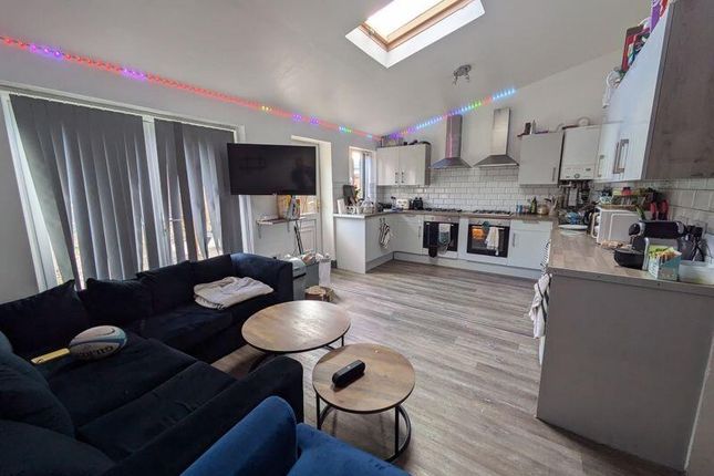 A Bright And Welcoming Living Room With Modern Fur...