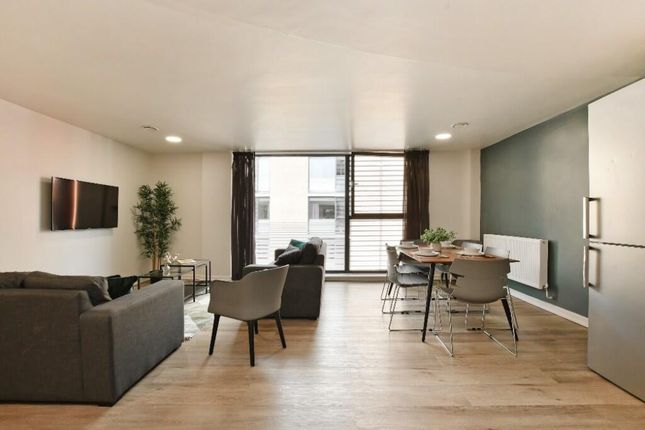 Bright And Spacious Contemporary Living Room Featu...