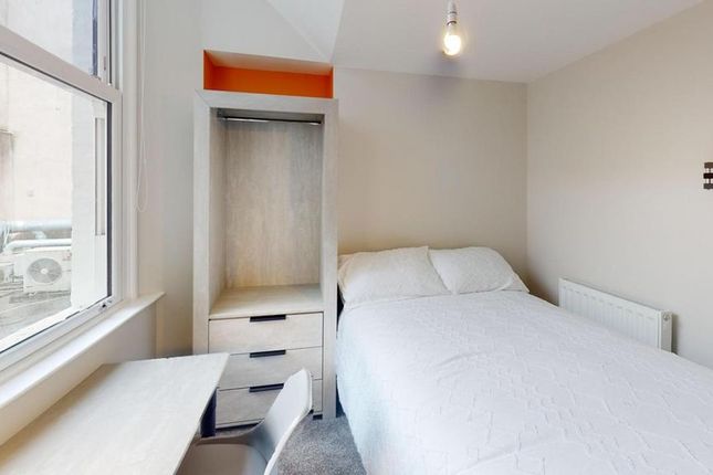 A Bright And Tidy Double Bedroom Featuring A Comfo...