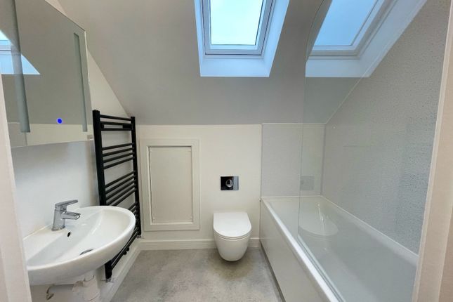 A Beautifully Designed Bathroom Suite Featuring A ...