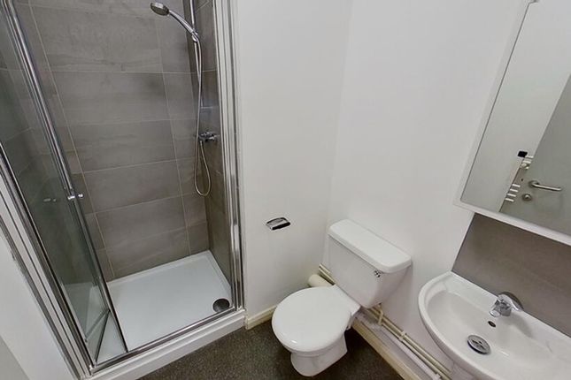Bright And Modern Bathroom Featuring A Spacious Sh...