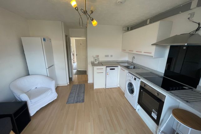 A Modern And Tidy Kitchenette Equipped With Essent...