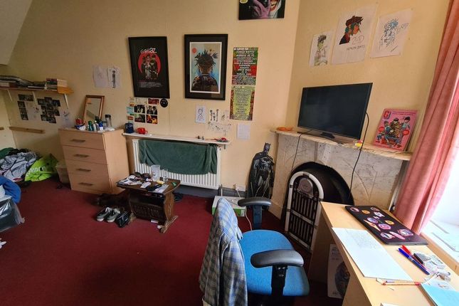 A Comfortably Spacious Master Bedroom Featuring A ...