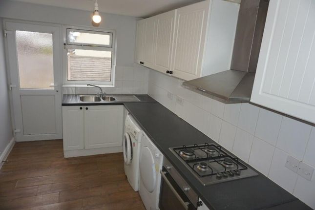 A Bright And Tidy Kitchenette With Modern Applianc...
