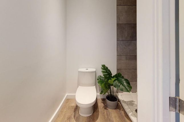 A Tidy And Modern Single Toilet With Stylish Decor...
