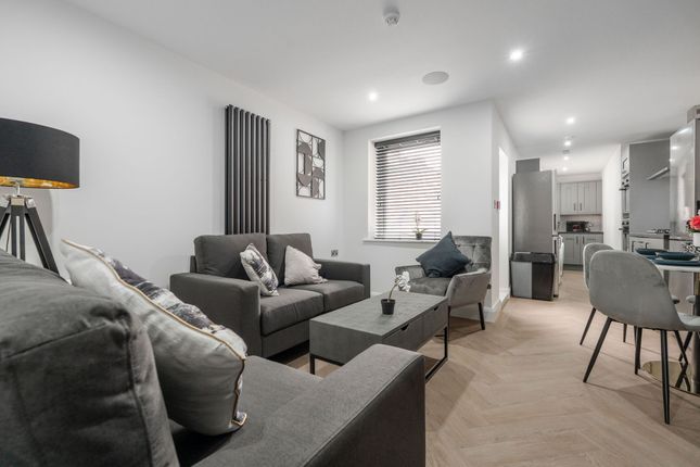 Modern And Stylish Living Room Featuring Comfortab...