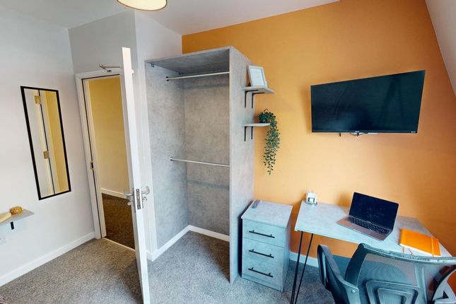 A Stylish And Tidy Double Bedroom Featuring A Work...