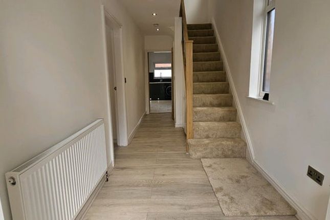 A Well-Maintained Hallway Featuring Modern Decor, ...