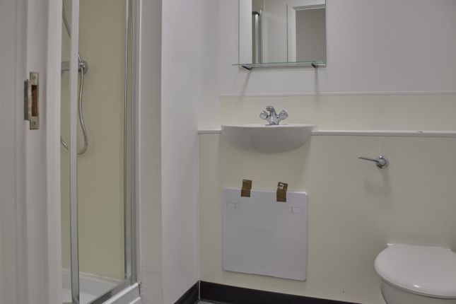 A Modern Bathroom Featuring A Sleek Shower And Min...