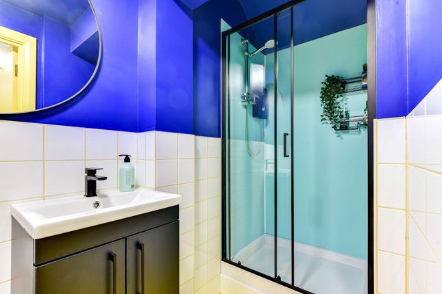 This Stylish Bathroom Features A Modern Shower Wit...