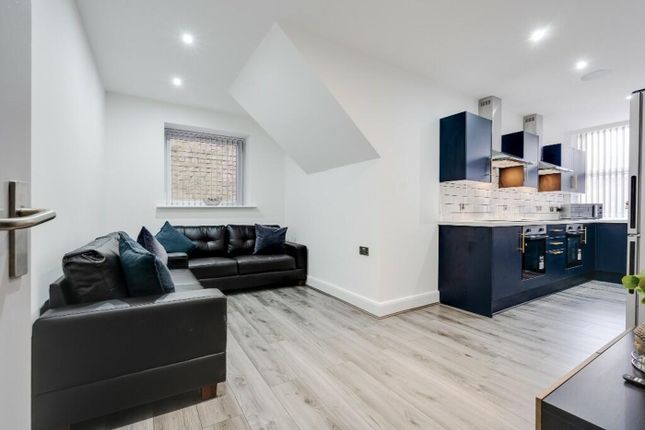 A Stylish And Modern Living Room Featuring A Cozy ...