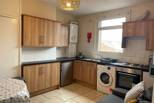 A Well-Maintained Kitchen Featuring Wooden Cabinet...
